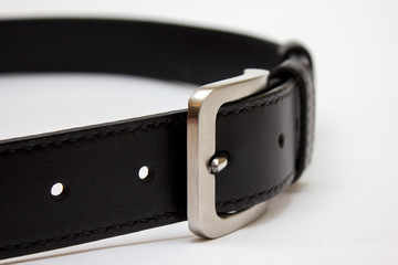 black leather belt isolated on white background