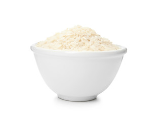 Bowl with uncooked rice on white background