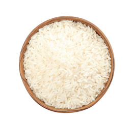 Bowl with uncooked rice on white background, top view