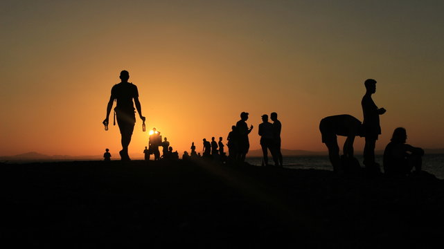 Silhouettes of  Travelers watching a Nicaraguan Sunset on Ometepe