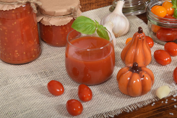 cocktail tomatoes, garlic, spices, colorful pumpkins and scattered kitchen salt