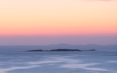 Fototapeta na wymiar Golden north sky after sunset, Bohuslän, Sweden.