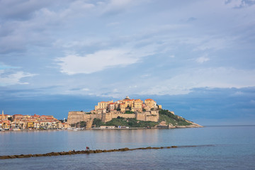Obraz na płótnie Canvas Beautiful view of the city of Calvi and the citadel from the seashore, Corsica, France