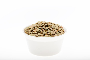 Bowl of green lentil on white background