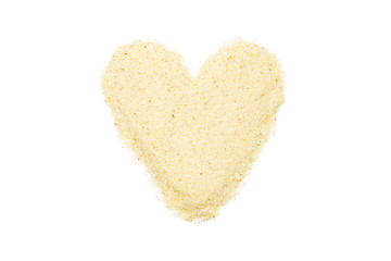 Semolina, heart-shaped, isolated, close up, macro, top view. Popular flour in cooking. Used for...