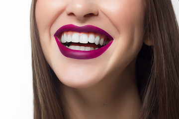 Fototapeta premium Perfect smile after bleaching. Dental care and whitening teeth. Stomatology and beauty care. Woman smiling with great teeth. Cheerful female smile with fresh clear skin and pink lips
