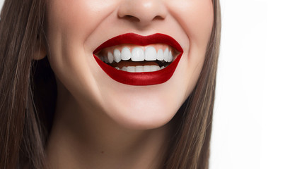 Close-up shot of sexy woman lips with red lipstick and white teeth. Perfect clean skin, fashion lip...