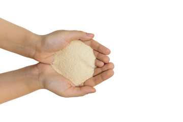 Semolina in female hands, isolated, close up, macro, top view. Popular flour in cooking. Used for...