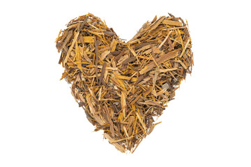 Catuaba bark tea, isolated heart-shaped. Natural herbal tea from powdered Catuaba tree bark....