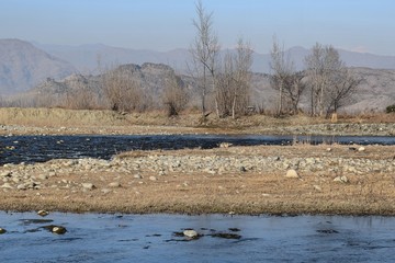 landscape with river and trees in winter