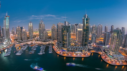 Beautiful aerial top view day to night timelapse of Dubai Marina in Dubai, UAE