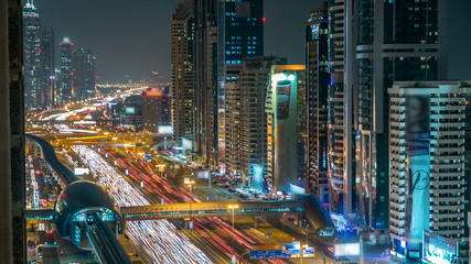 Downtown Dubai towers night timelapse. Aerial view of Sheikh Zayed road with skyscrapers.