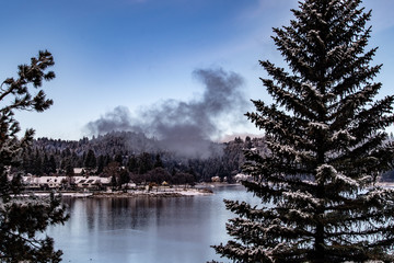 Early  morning view of Lake Arrowhead, California in the winter with beautiful sky, water reflections, trees, and many colors