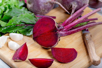 beet with leaves on wooden background