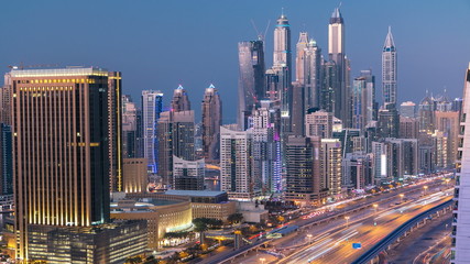 Fototapeta na wymiar Beautiful aerial top view day to night timelapse of Dubai Marina and JLT in Dubai, UAE