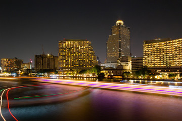 Fototapeta na wymiar Chao Phraya River and light boat with Bangkok city skyline Cityscape night in Thailand 