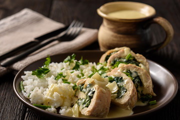 Spinach and mozzarella stuffed chicken fillet baked in oven.