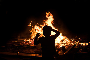 Little jewish boy do bonfire at Jewish holiday of Lag Baomer