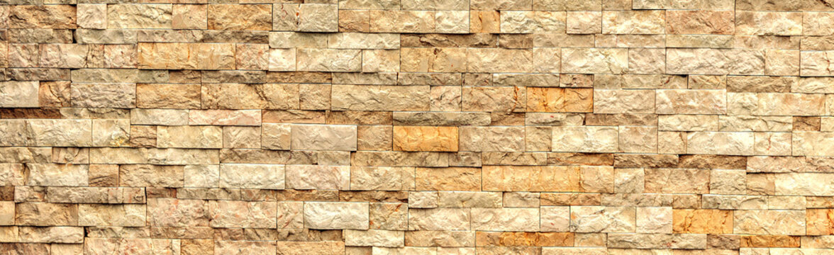grey and rough sandstone wall texture and background