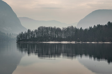 Beautiful foggy lake in the mountains