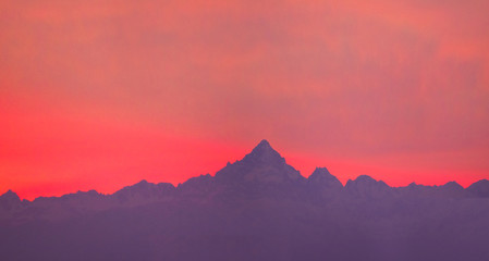 Monviso mountains at sunset, the highest mountain of the Cottian Alps in Piedmont, Italy - obrazy, fototapety, plakaty