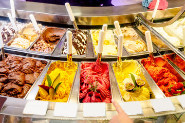 various flavors of gelato ice-cream at the showcase in dessert shop - obrazy, fototapety, plakaty