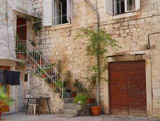 Fototapeta na wymiar stairs in the yard, Croatia, Trogir, street foto