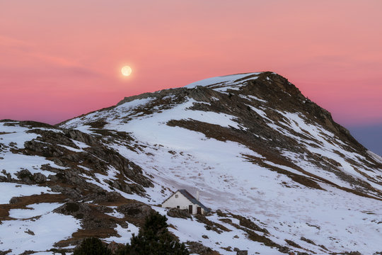 Full moon over Larra covered by snow in December