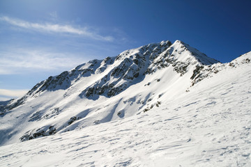 Winter landscape with hills covered with snow at Pirin Mountain, view from Todorka peak, Bulgaria