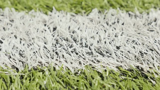 White line of the soccer field. Close-up horizontal slider shot