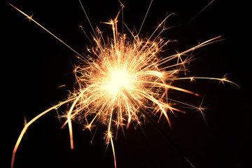 Bengal fire fireworks on black background / sparkling fireworks on black macro background