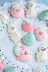 Obraz na płótnie Canvas Tasty and beautiful marshmallows in the form of: Christmas trees, muzzles of pigs, snowmen,
