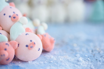 Tasty and beautiful marshmallows in the form of: Christmas trees, muzzles of pigs, snowmen,