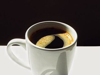 cup of coffee on black background