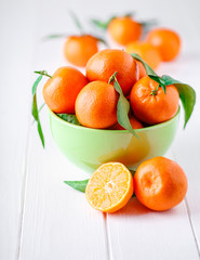 bowl of fresh mandarins, straight from the tree