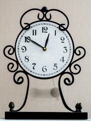 vintage table clock with blurred pendulum in motion