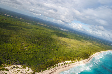 Fototapeta premium Coastal zone of the Dominican Republic. View from the cockpit of the helicopter.