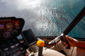 View of the Atlantic Ocean and the coast of the Dominican Republic from the cockpit of a helicopter © Viktor