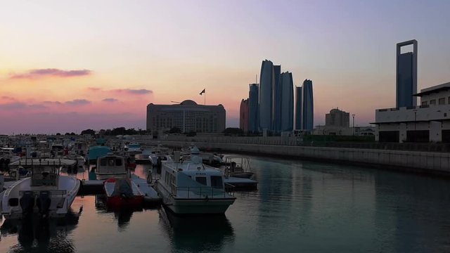 Beautiful view of Abu Dhabi city Etihad towers, famous landscape and Marina boats