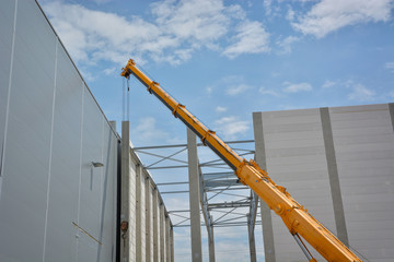 Boom of mobile crane with blue sky background. © Razvan