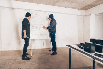 Fototapeta premium Violent men making plan for robbery