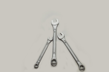 Top view, Stainless steel three wrenchs or spanners size 12,13,14 mm on isolated white background