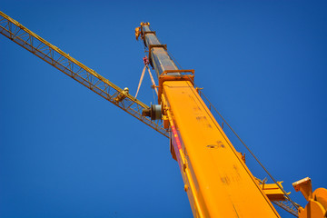 High arms of crane in building site