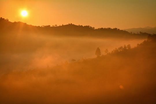 the morning autumn landscape with fog Holbav,Romania