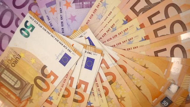 VIDEO, extremely close-up of euro banknotes, rotational slow motion 