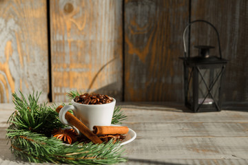  Cup with coffee beans on a wooden table