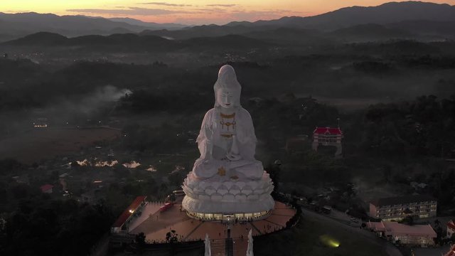 Aerial scene of GuanYin Statue Wat Huay Pla Kang, Chiang Rai in sunset scene