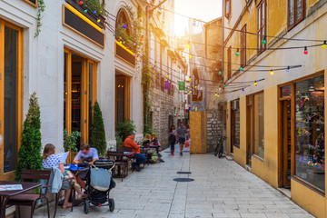 Fototapeta premium Street in Split historical center, Croatia. Beautiful square of the old town of Split in Croatia. Old stone street of Split historic city, Dalmatia, Croatia