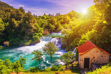 Fototapeta premium Waterfalls Krka, National Park, Dalmatia, Croatia. View of Krka National Park, Roski Slap location, Croatia, Europe. Beautiful world of Mediterranean countries. Traveling concept background.