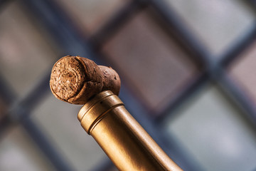 champagne cork on top of bottle of wine horizontal with copy space